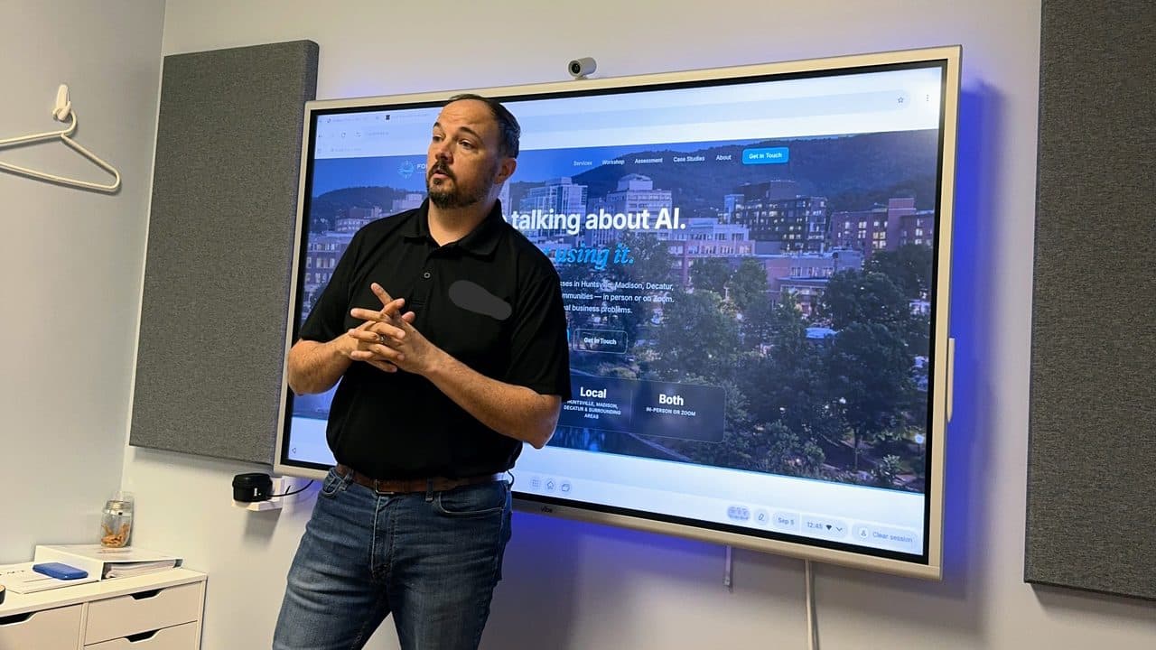A Four Stones AI workshop session in front of a smartboard